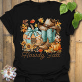 Black t-shirt featuring the design Howdy Fall printed in brown letters, cute fall aesthetic shirt.