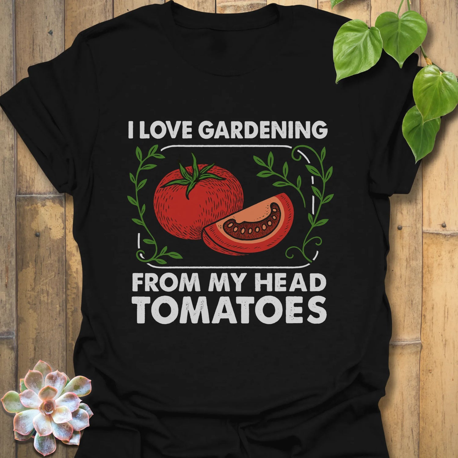 Black t-shirt featuring the design I Love Gardening printed in bold white letters, garden lover t-shirt.
