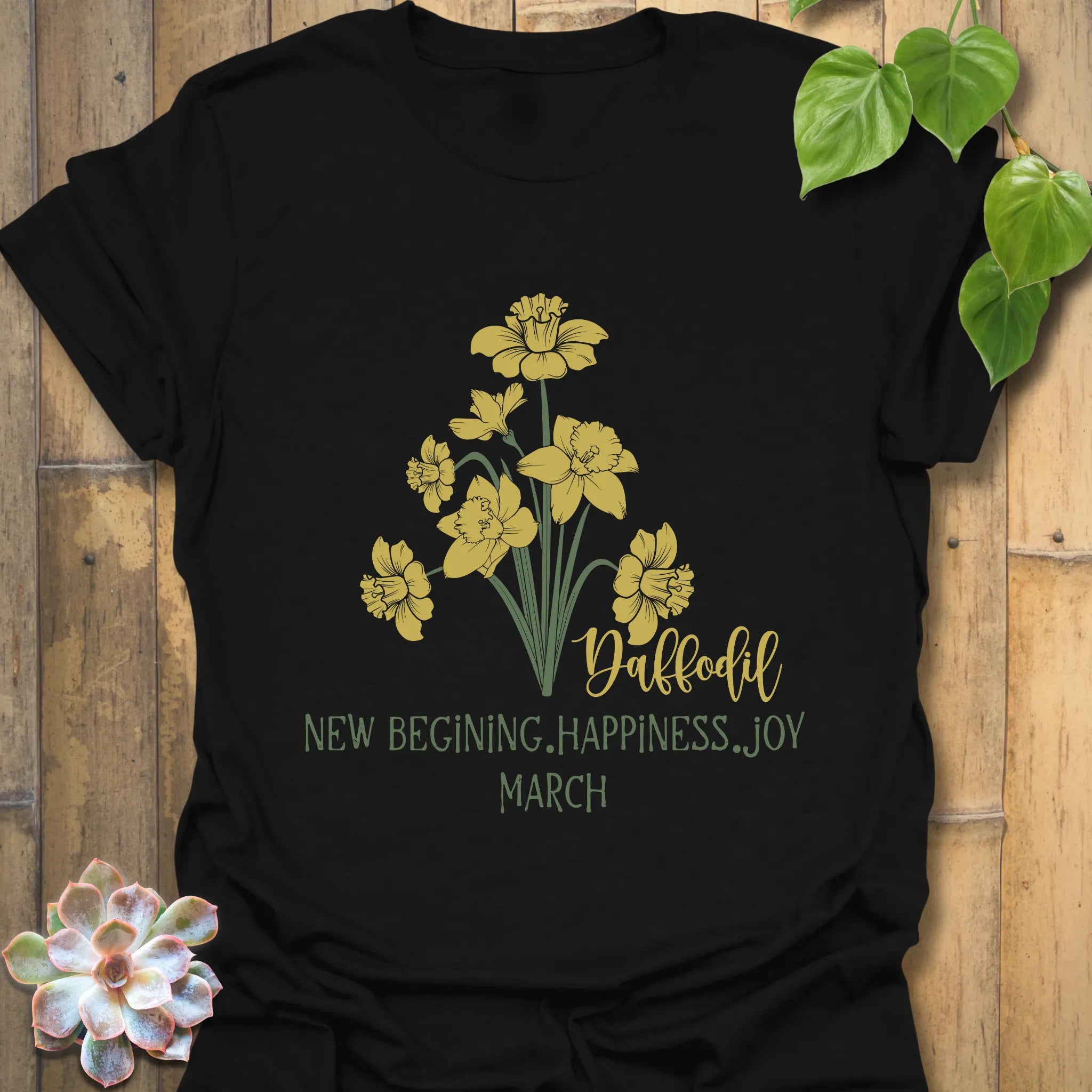 Black t-shirt featuring the design March Daffodil with a print of flower Rose, a bold floral graphic shirt.