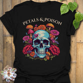 Black t-shirt featuring the design Petals & Poison printed in bold letters, gothic floral shirt.