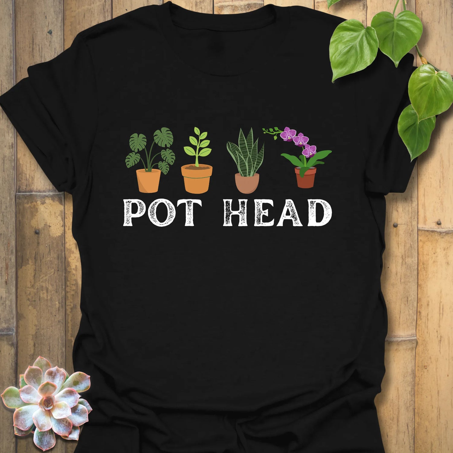 Black t-shirt featuring the design Pot Head with flowers in a pot, bold botanical humour tee.