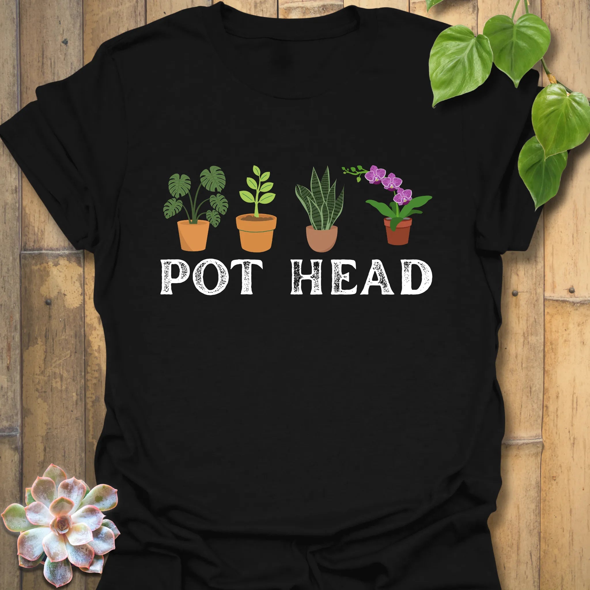 Black t-shirt featuring the design Pot Head with flowers in a pot, bold botanical humour tee.