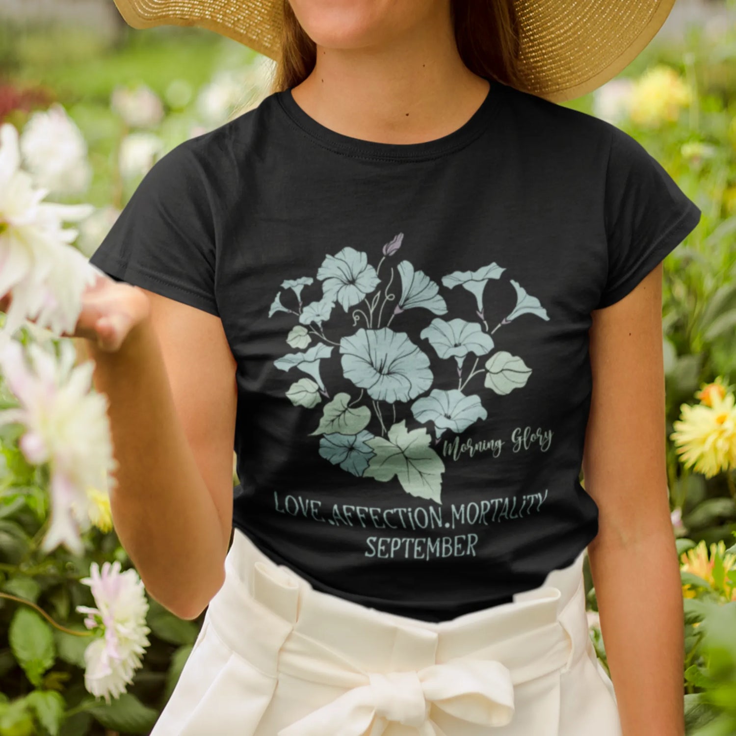 Black t-shirt featuring the design September Morning Glory with a flower print, a bold floral graphic tee that adds a stylish touch to any outfit.