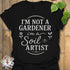 Black t-shirt featuring the design Soil Artist printed in bold letters, funny garden shirt.
