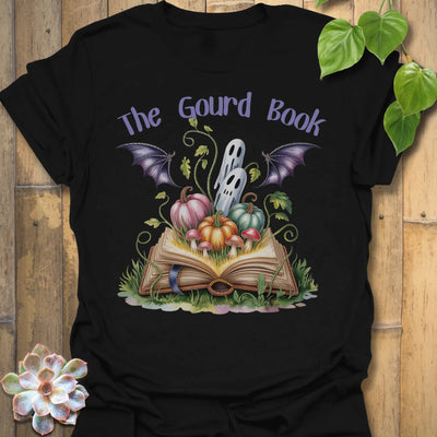 Black t-shirt featuring the design The Gourd Book printed in halloween pumpkin shirt.