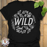 Black t-shirt featuring the design Wild Soul printed in bold white letters, nature-inspired shirt.