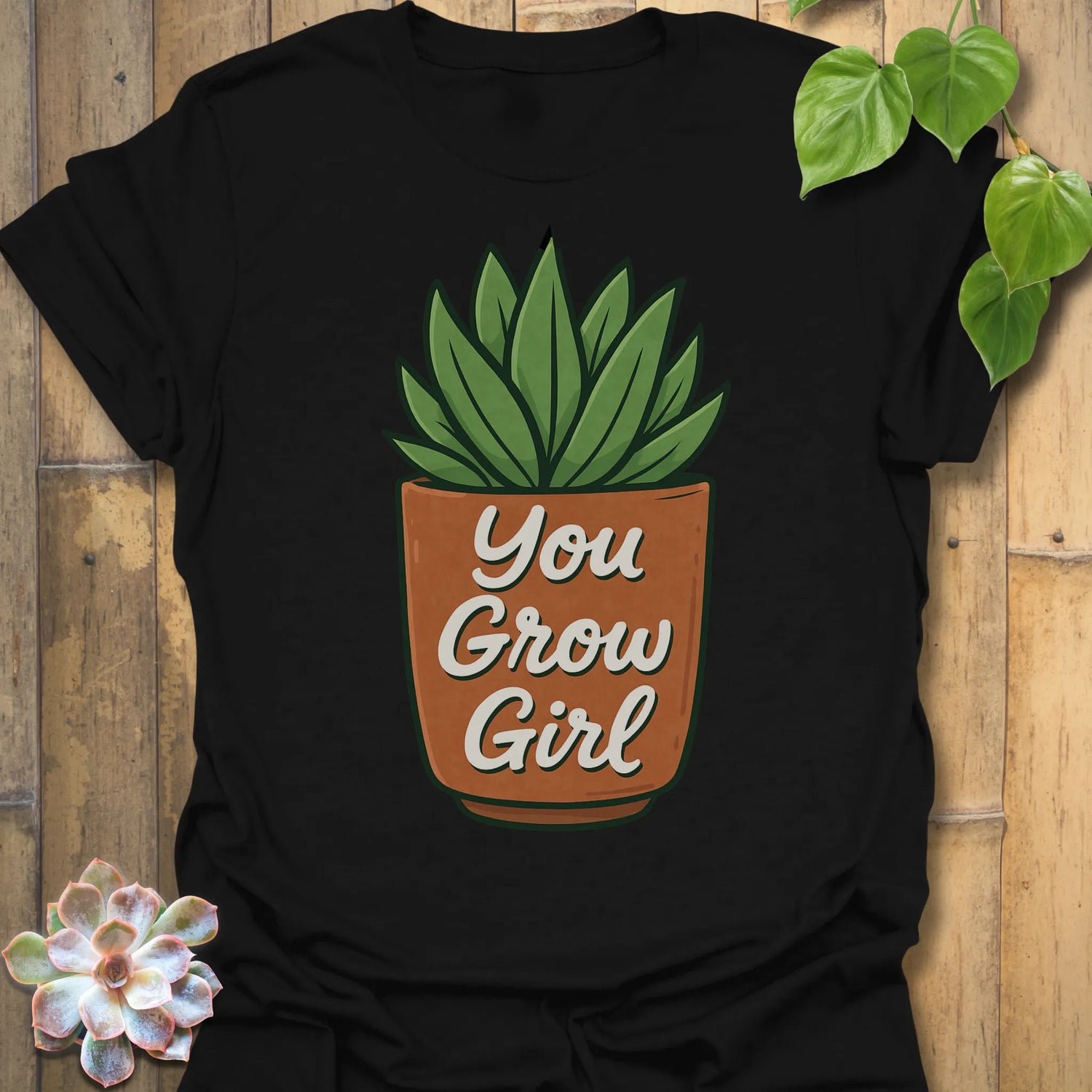 Black t-shirt featuring the design You Grow Girl printed in inspiring plant lover shirt.