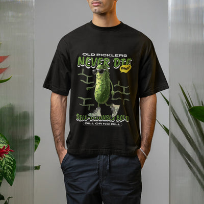 Black t-shirt with the design “Old Pickles Never Die Dill-Iliously Bold,” showing a cool cucumber character wearing sunglasses