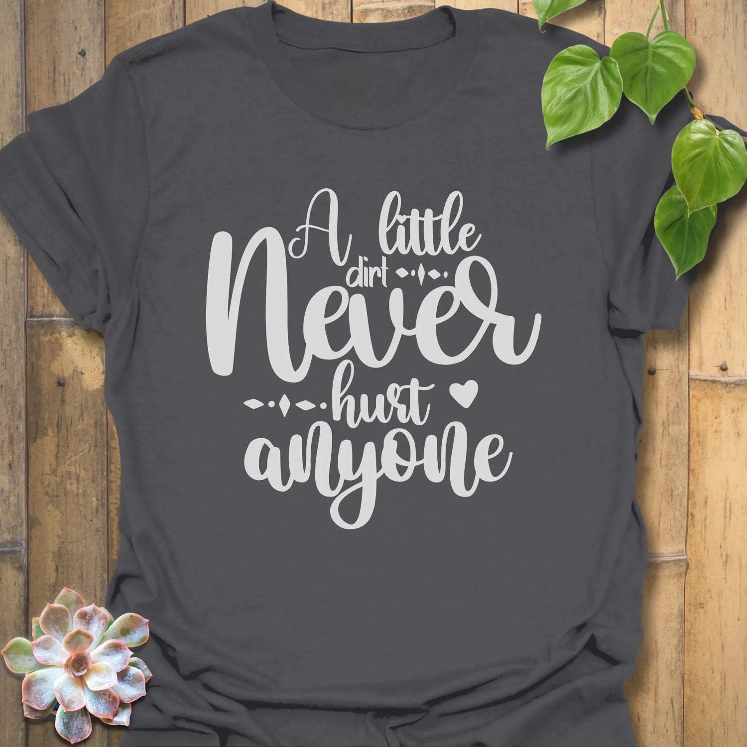 Charcoal grey garden lover t-shirt with the phrase A Little Dirt Never Hurt Anyone in bold lettering.