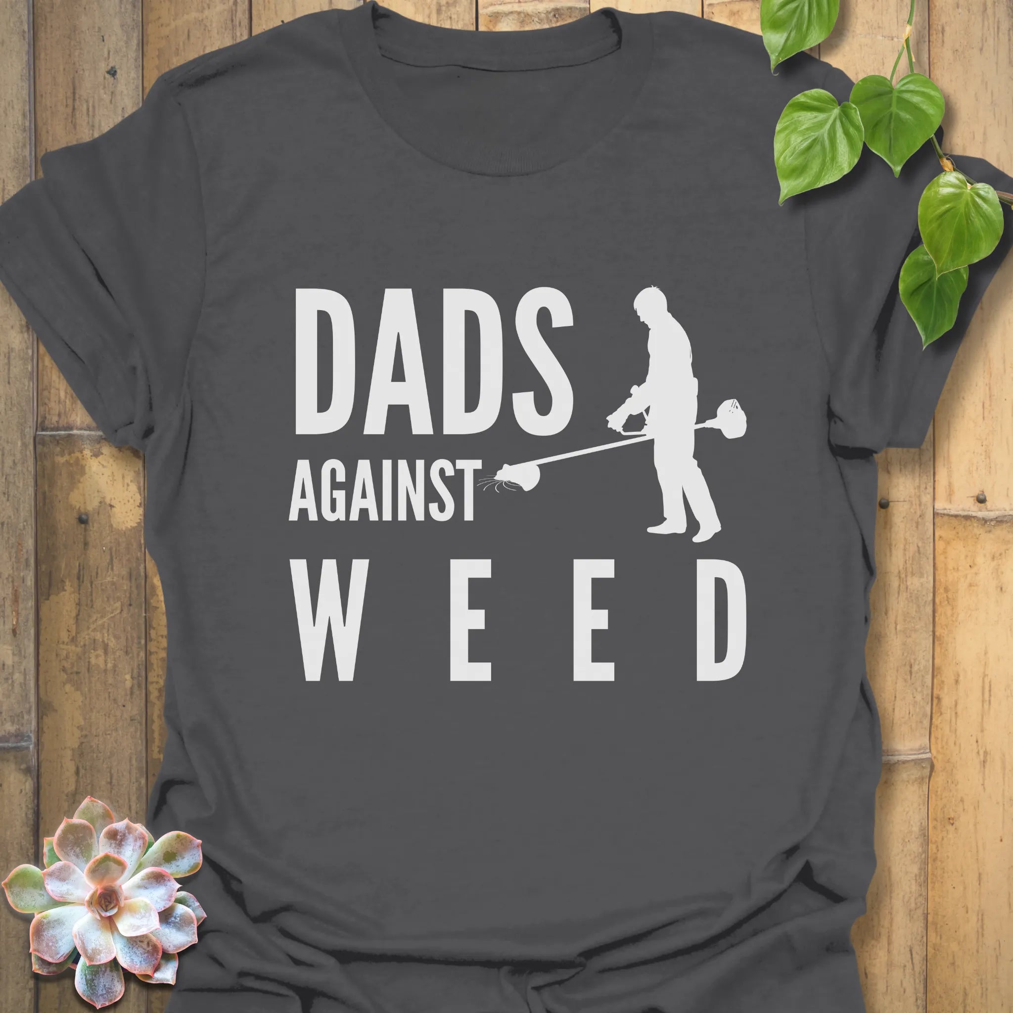 Charcoal t-shirt featuring the design Dad Against Weeds, funny yard work shirt for dads.