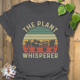 Charcoal t-shirt featuring the design The Plant Whisperer with a plant in a pot, a unique gardening shirt for plant enthusiasts and gift giving.