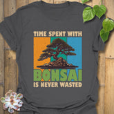 Charcoal t-shirt featuring the design “Time spent with bonsai is never wasted” with a bonsai plant print, perfect for casual outfits and bonsai enthusiasts.