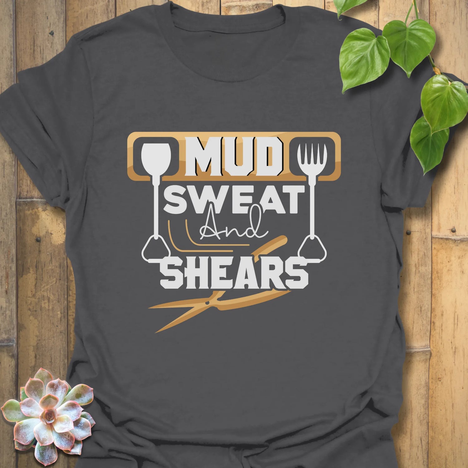 Charcoal unisex t-shirt featuring the design Mud Sweat And Shears, durable gardening shirt for men and women.