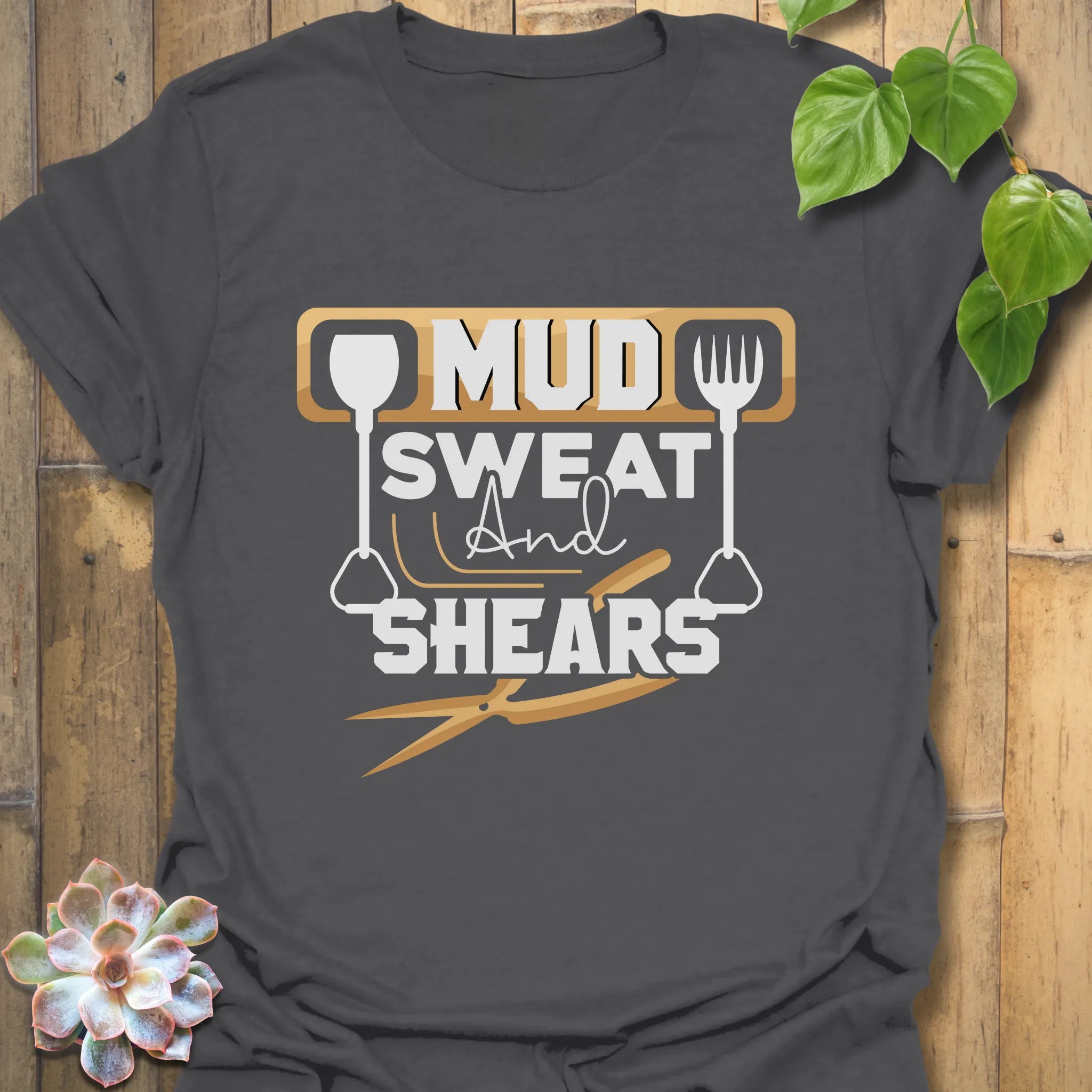 Charcoal unisex t-shirt featuring the design Mud Sweat And Shears, durable gardening shirt for men and women.