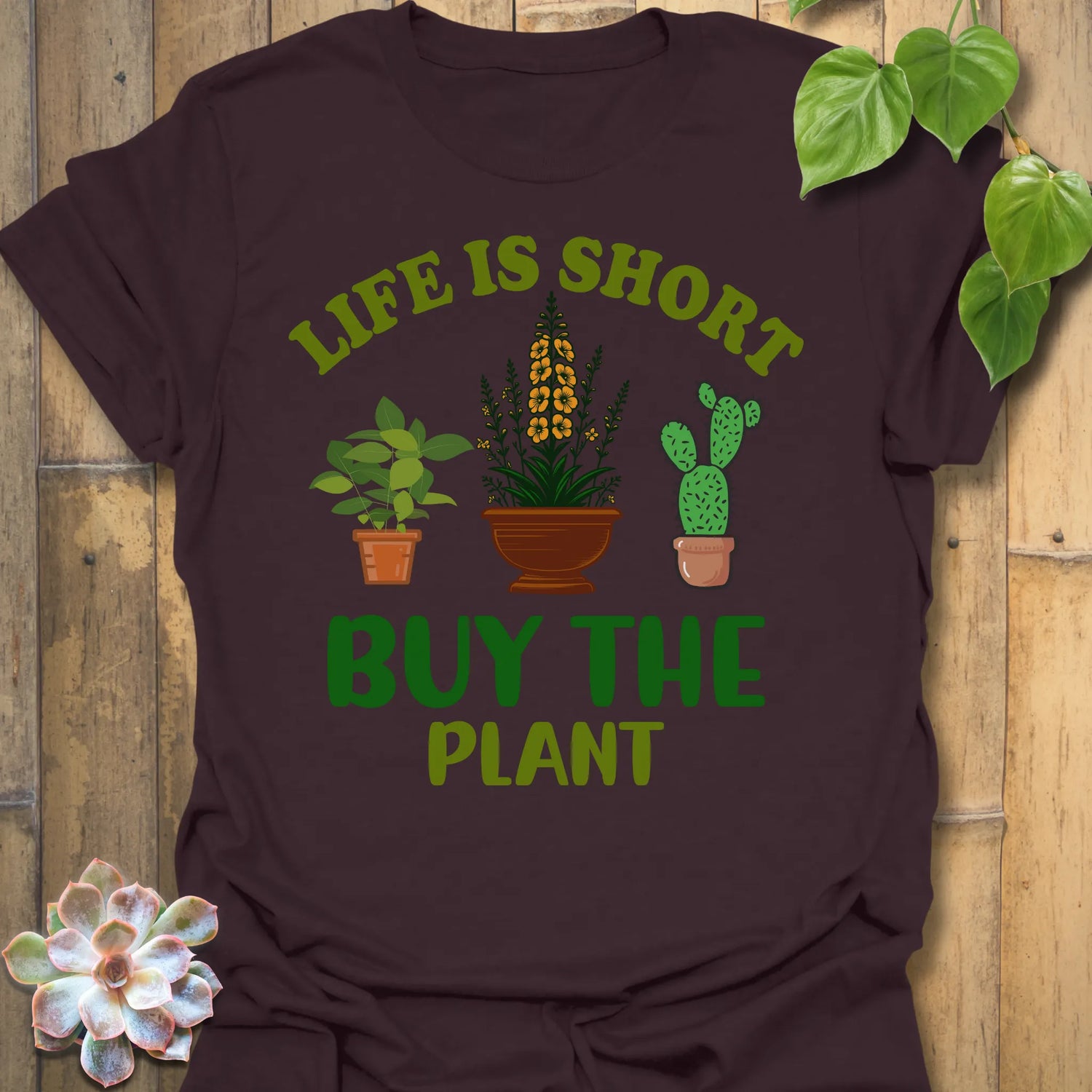 Dark Chocolate t-shirt featuring the design Buy The Plant printed in bold letters, funny gardening shirt.