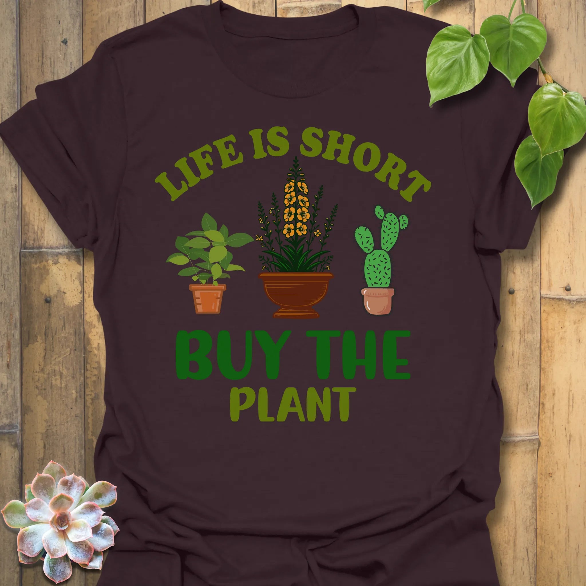 Dark Chocolate t-shirt featuring the design Buy The Plant printed in bold letters, funny gardening shirt.