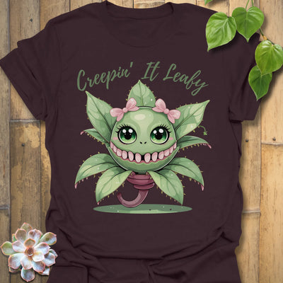 Dark Chocolate t-shirt featuring the design Creepin’ It Leafy printed in bold black letters, gardening graphic shirt.