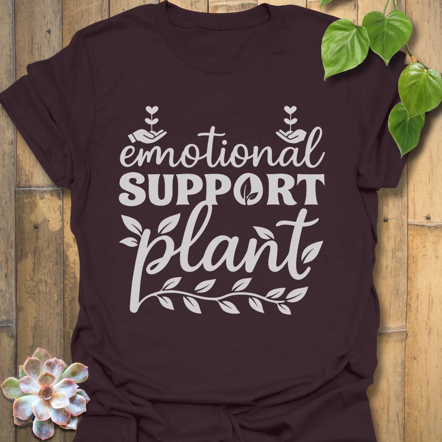 Dark Chocolate t-shirt featuring the design Emotional Support printed in bold letters, plant wellness graphic shirt.