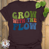 Dark Chocolate t-shirt featuring the design Grow With The Flow printed in bold colorful letters, mindful garden shirt.