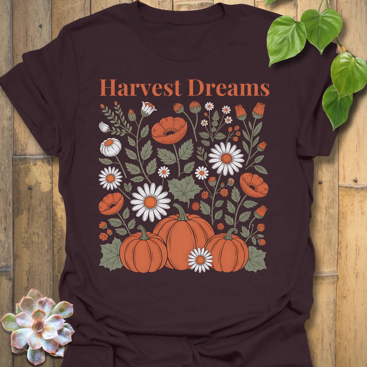 Dark Chocolate t-shirt featuring the design Harvest Dreams printed in bold orange letters, cosy harvest tee.