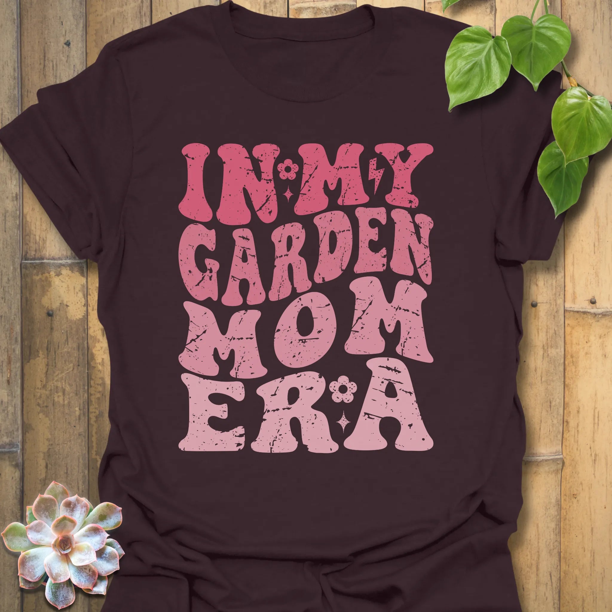 Dark Chocolate t-shirt featuring the design In My Garden Mom Era printed in bold letters, gardening shirt for moms.