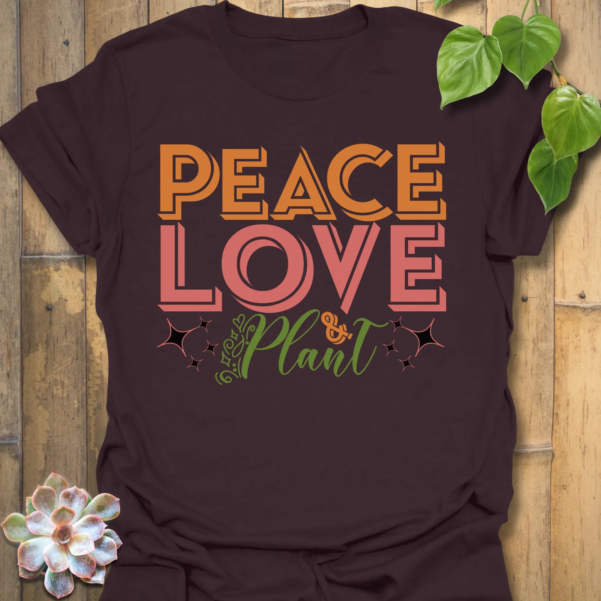 Dark Chocolate t-shirt featuring the design Peace Love Plant printed in bold letters, gardening lover shirt.