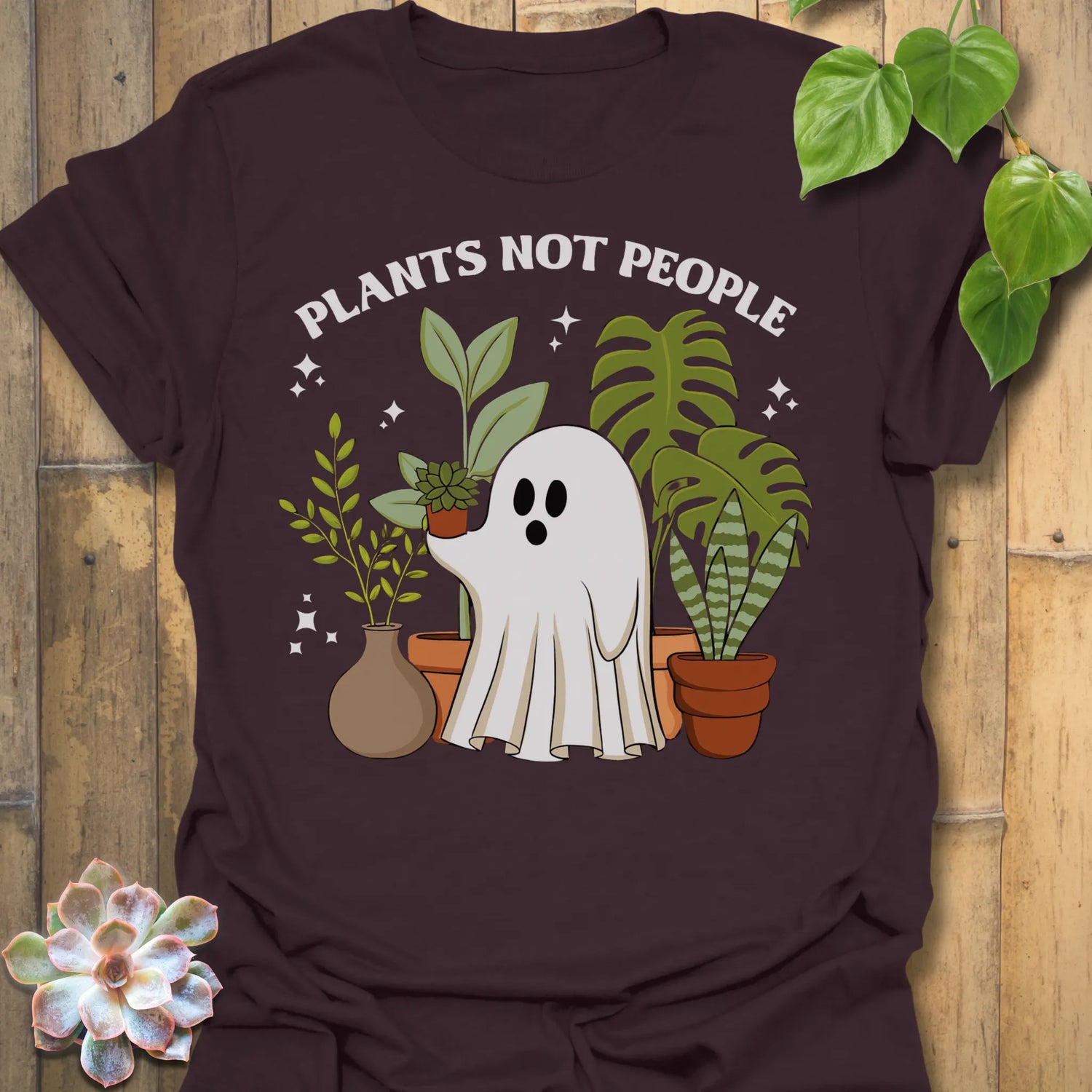 Dark Chocolate t-shirt featuring the design Plants Not People printed in bold white letters, halloween plant lover graphic tee.