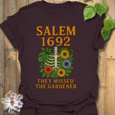 Dark Chocolate t-shirt featuring the design Salem 1692 printed in bold letters, vintage halloween graphic tee.
