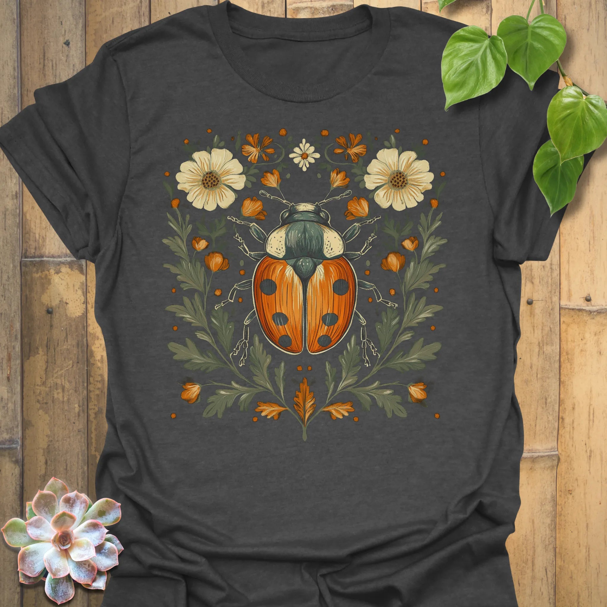 Dark Heather t-shirt featuring the design Blossom Beetle printed in nature-inspired floral beetle shirt.