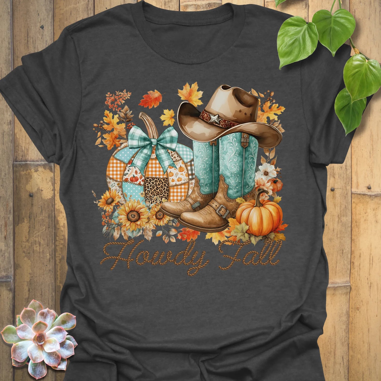 Dark Heather t-shirt featuring the design Howdy Fall printed in brown letters, cute fall aesthetic shirt.