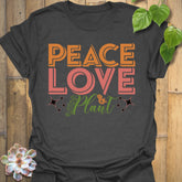 Dark Heather t-shirt featuring the design Peace Love Plant printed in bold letters, gardening lover shirt.