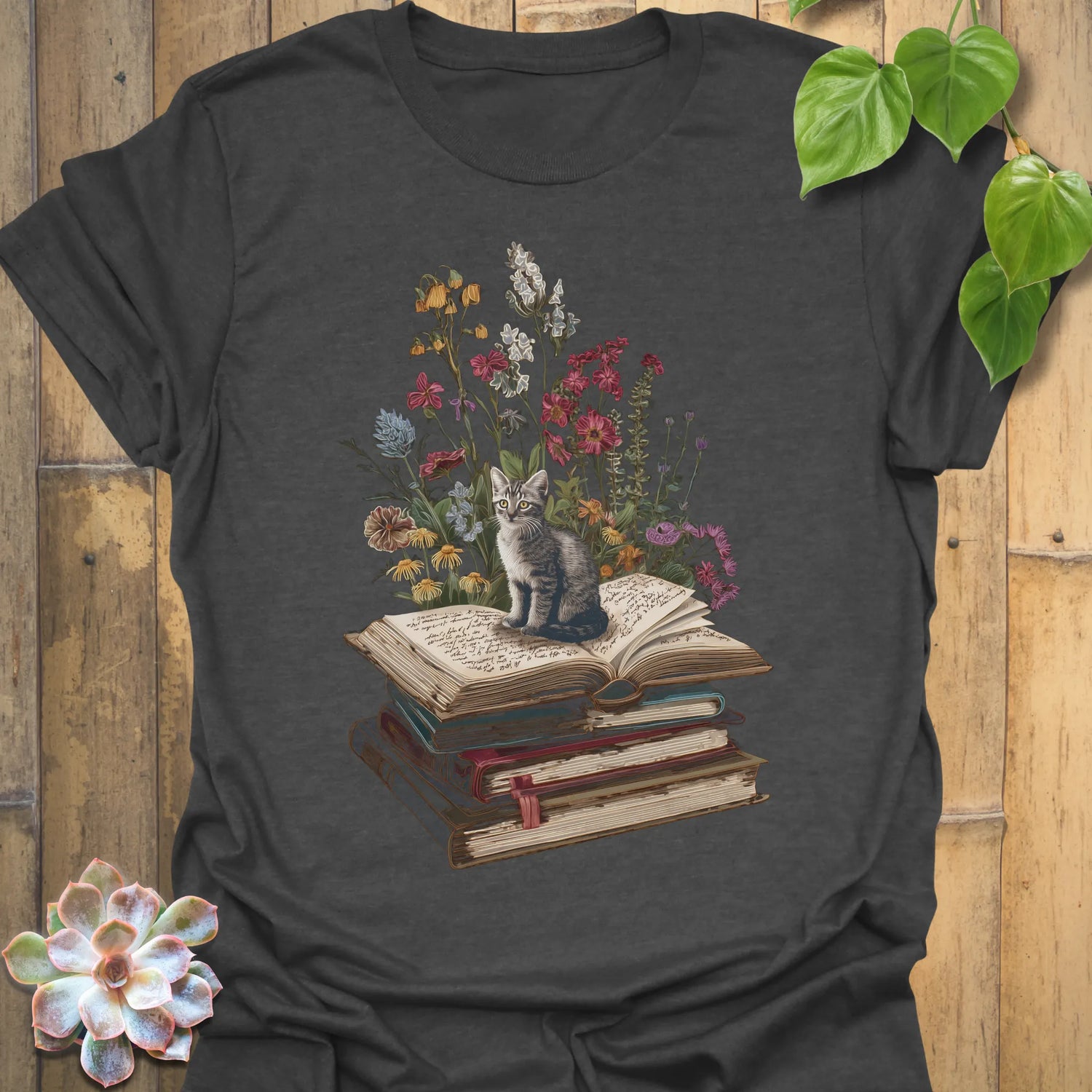 Dark Heather t-shirt featuring the design Whiskers &amp; Words printed in books and cats with flowers, cat lover reading shirt.