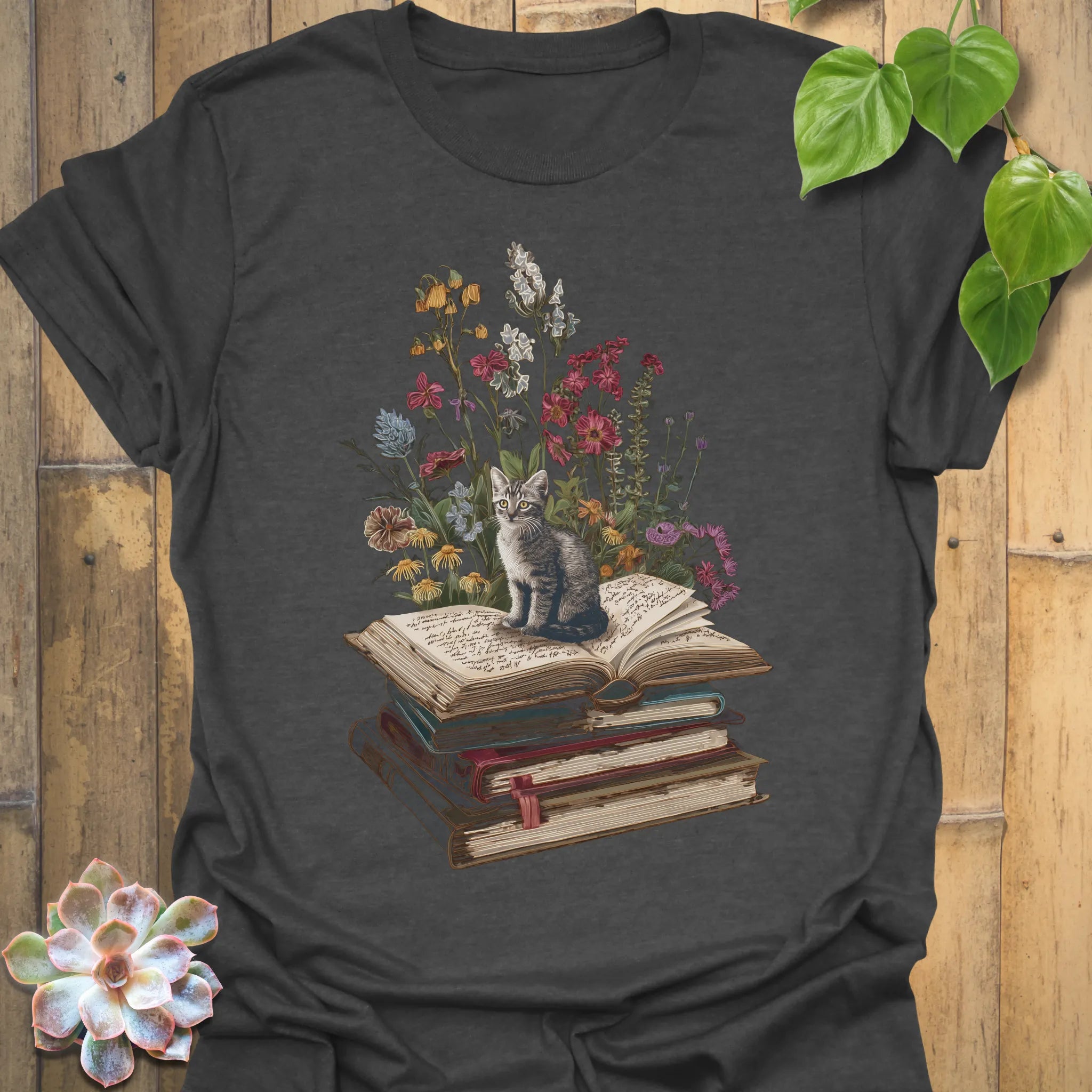 Dark Heather t-shirt featuring the design Whiskers &amp; Words printed in books and cats with flowers, cat lover reading shirt.