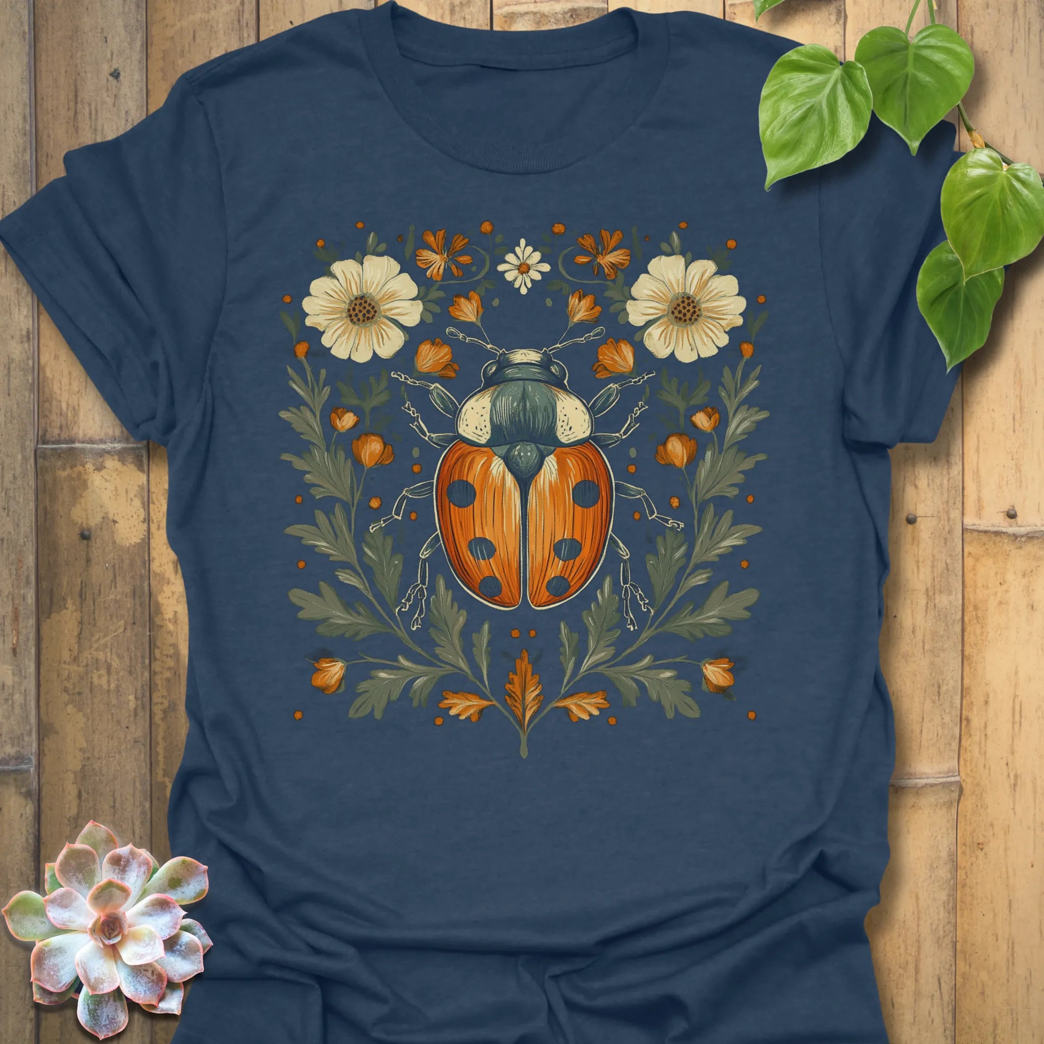Heather Navy t-shirt featuring the design Blossom Beetle printed in nature-inspired floral beetle shirt.