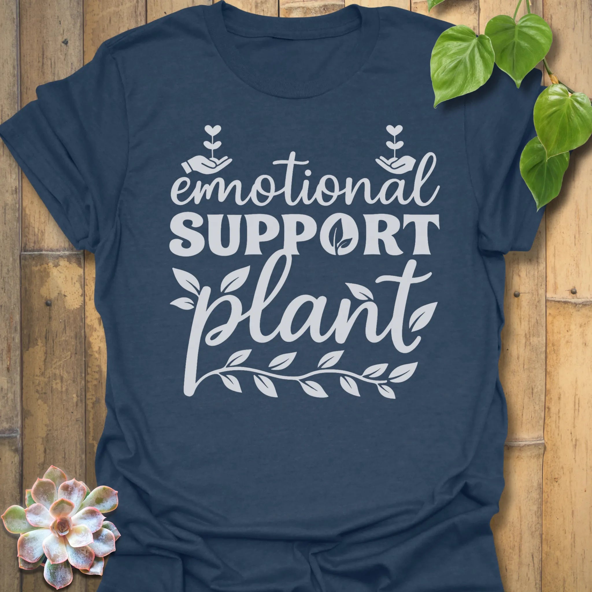 Heather Navy t-shirt featuring the design Emotional Support printed in bold letters, plant wellness graphic shirt.