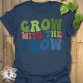 Heather Navy t-shirt featuring the design Grow With The Flow printed in bold colorful letters, mindful garden shirt.