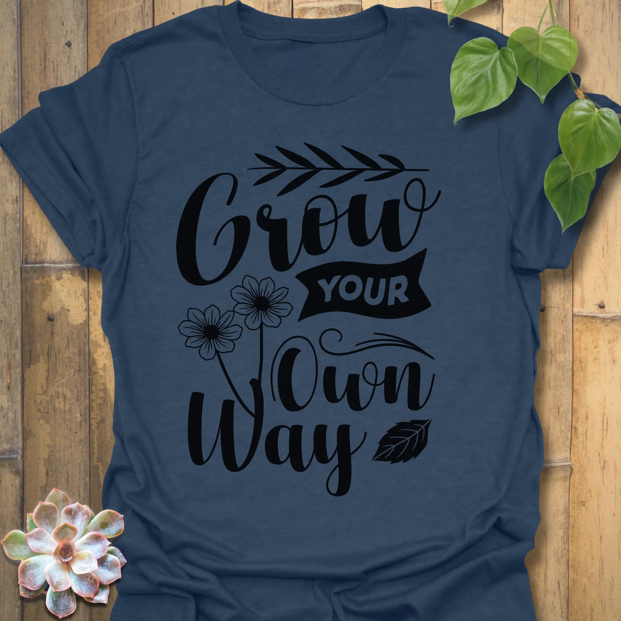 Heather Navy t-shirt featuring the design Grow Your Own Way printed in bold black letters, positive garden shirt