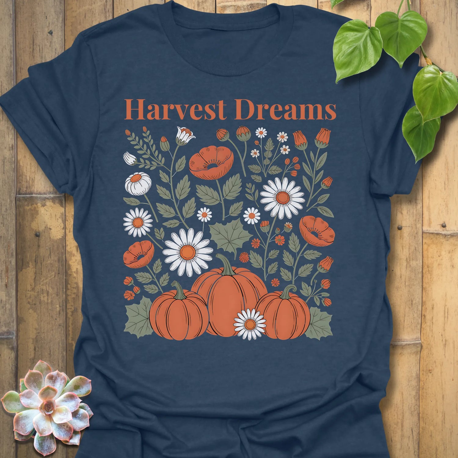 Heather Navy t-shirt featuring the design Harvest Dreams printed in bold orange letters, cosy harvest tee.