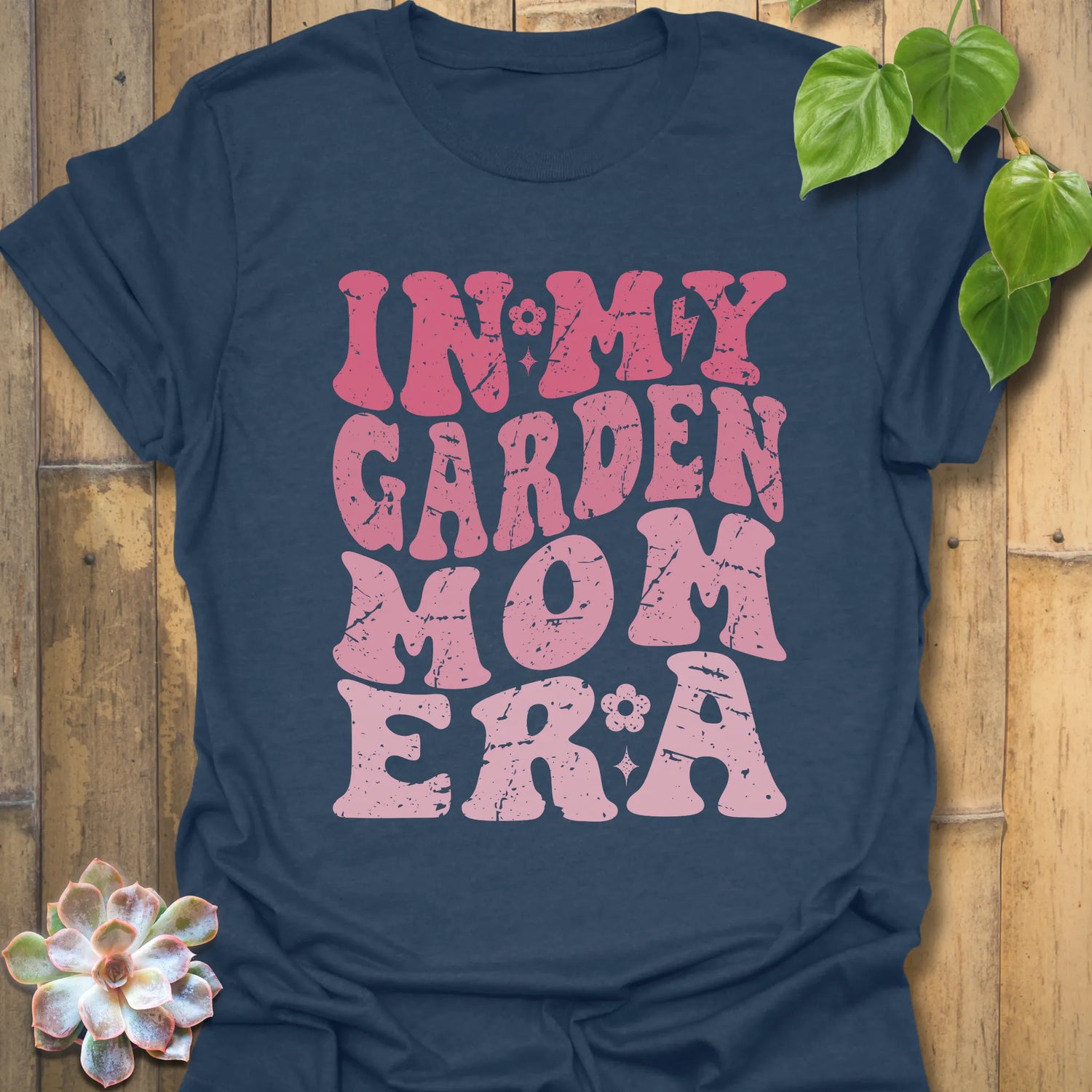 Heather Navy t-shirt featuring the design In My Garden Mom Era printed in bold letters, gardening shirt for moms.