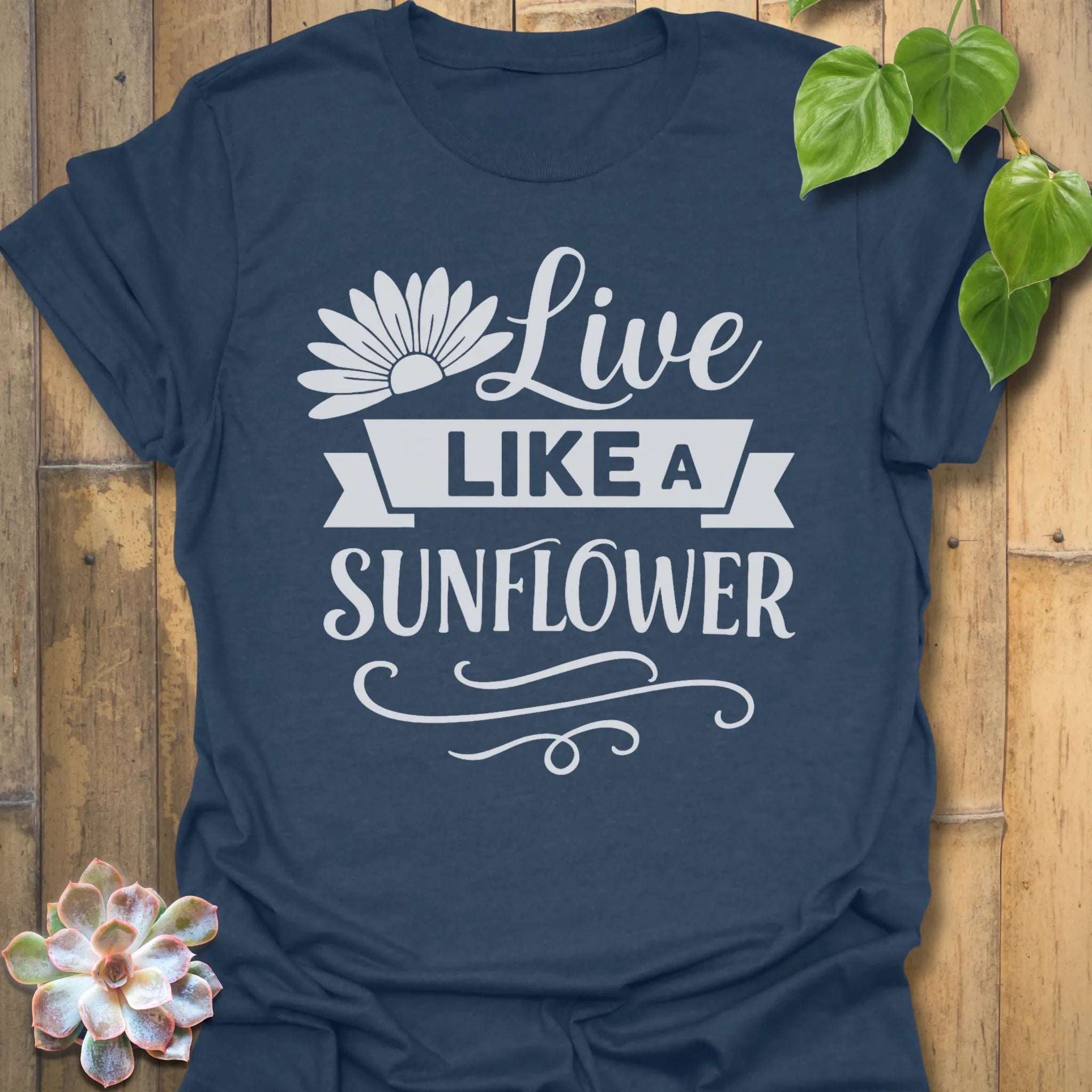 Heather Navy t-shirt featuring the design Live Like A Sunflower printed in bold black letters, sunflower lover shirt.
