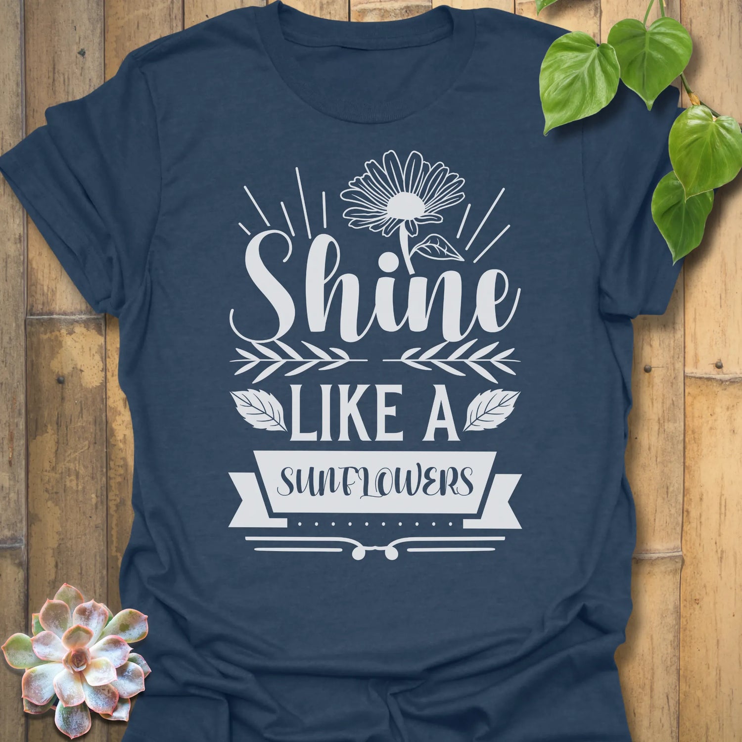 Heather Navy t-shirt featuring the design Shine Like A Sunflower printed in bold letters, sunflower lover shirt.