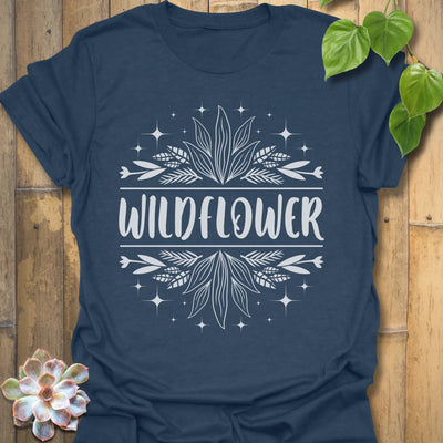 Heather Navy t-shirt featuring the design Wildflower printed in bold white letters, floral graphic shirt.