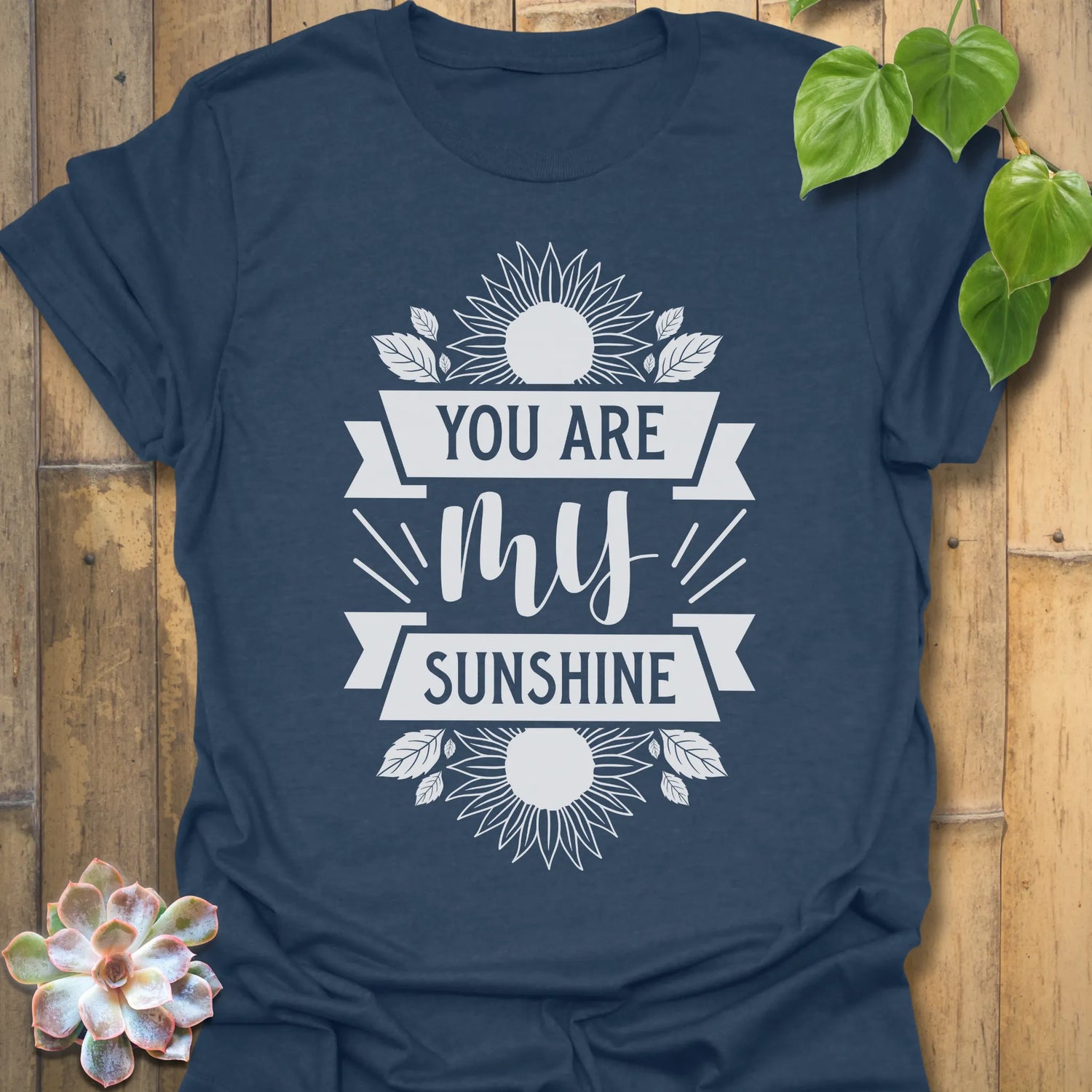 Heather Navy t-shirt featuring the design You Are My Sunshine printed in bold letters, nature-inspired graphic tee.