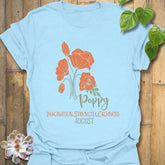 Light Blue t-shirt featuring the design August Poppy with a floral print, a stylish flower graphic tee for relaxed casual looks.