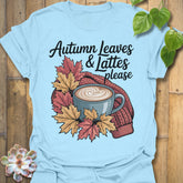 Light Blue t-shirt featuring the design Autumn Leaves & Lattes printed in cosy fall shirt for coffee lovers.