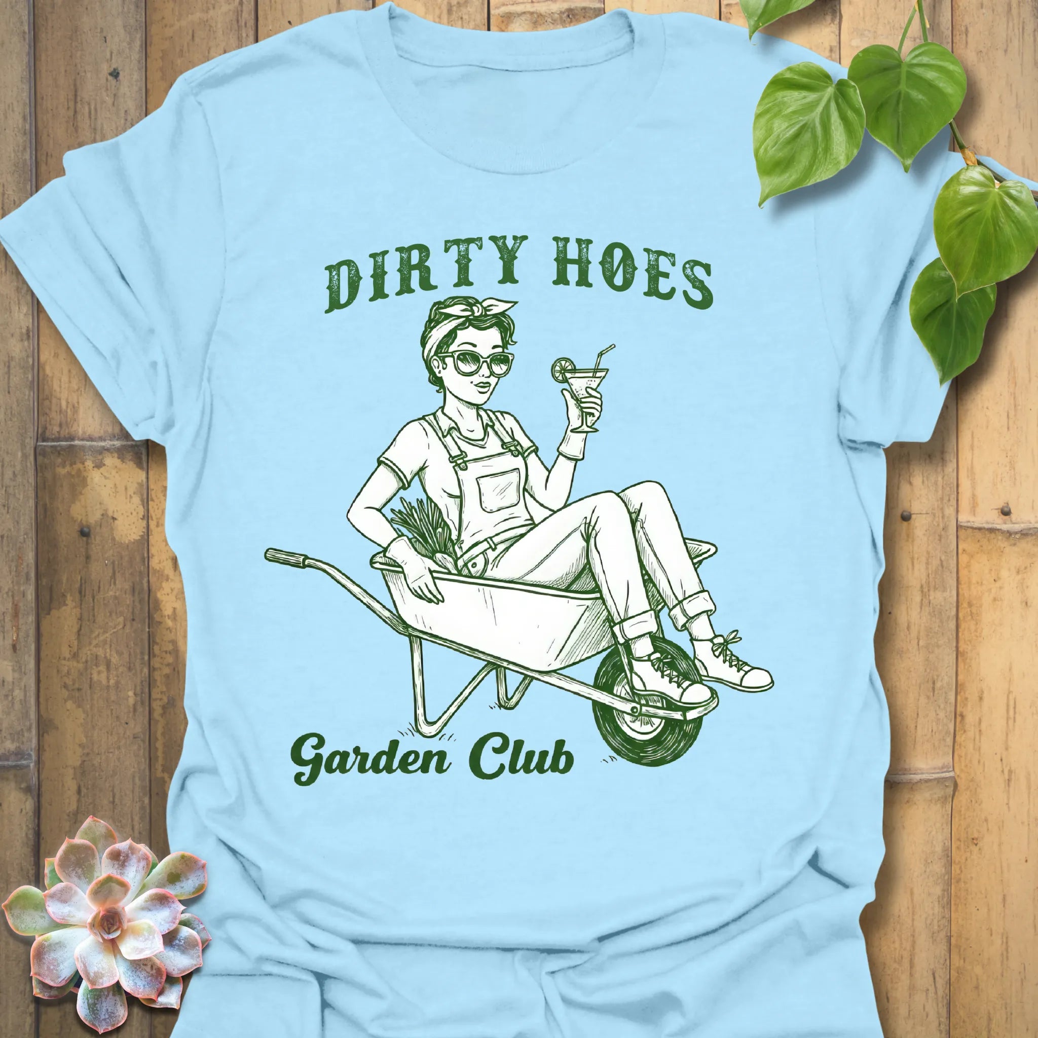 Light Blue t-shirt featuring the design Garden Club printed in bold green letters, garden lover t-shirt.