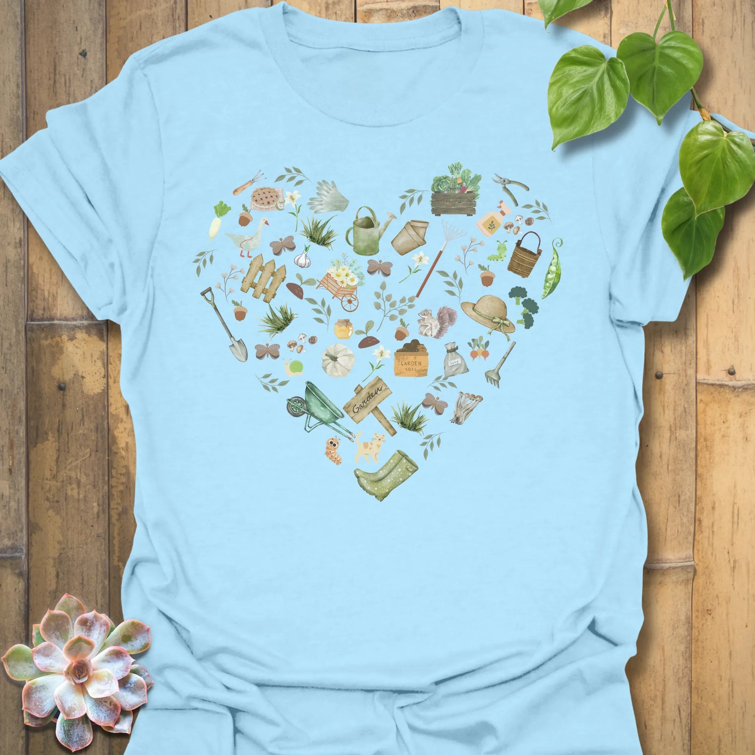 Light Blue t-shirt featuring the design Gardening Loveheart printed in gardening graphic, perfect for plant lovers.