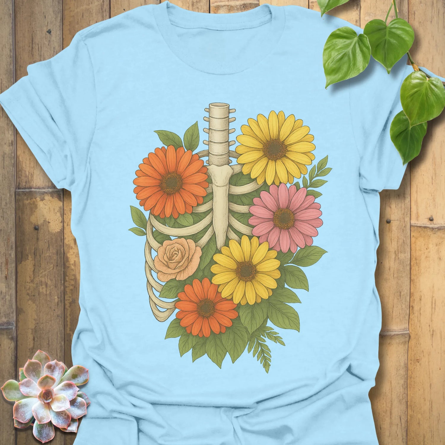 Light Blue t-shirt featuring the design Gerbera Bones printed in floral skeleton graphic tee.