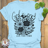 Light Blue t-shirt featuring the design God Is Good printed in black letters, religious faith shirt.