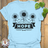 Light Blue t-shirt featuring the design Hope printed in sunflower and bold letters, positive vibe t-shirt.